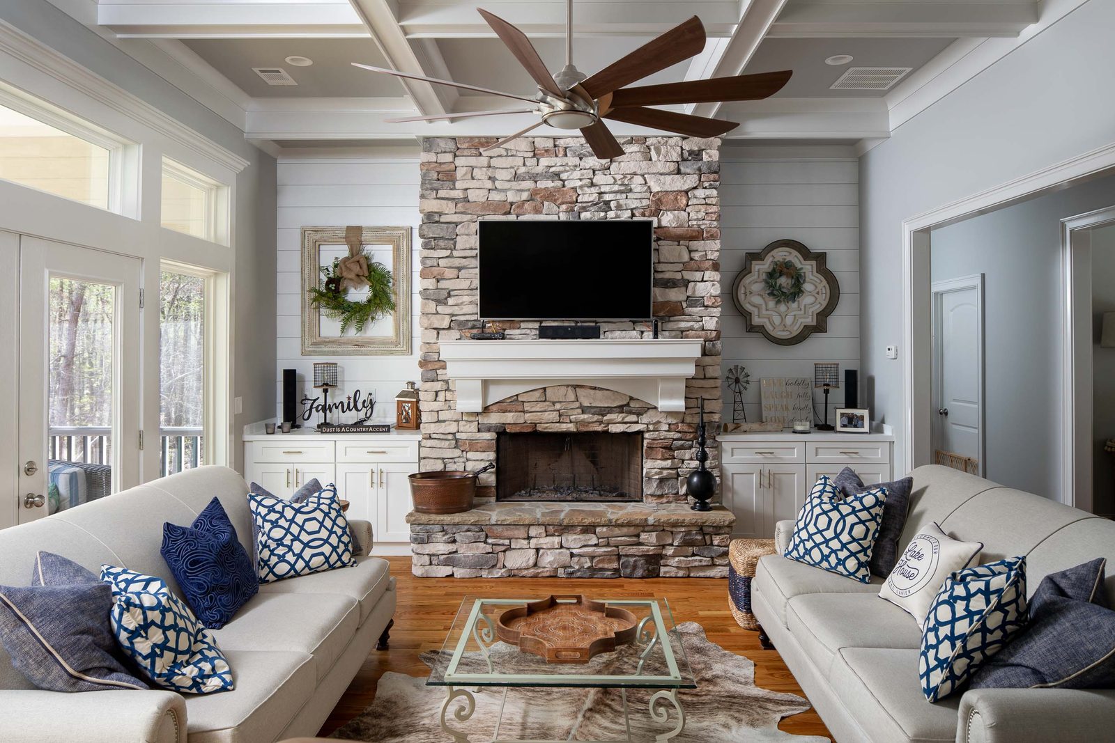 Great room with stone fireplace and sectional seating — Imbriale, custom home built by Ironwood Construction Group